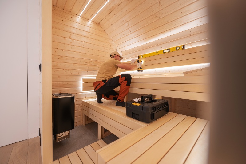 Technician maintaining home sauna in Denver Metro Area